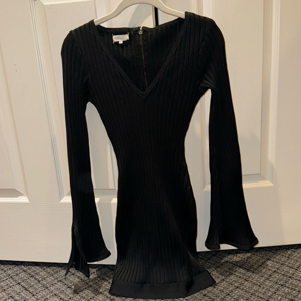 Mistress rocks black ribbed mini dress